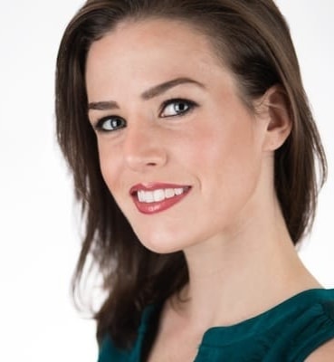Professional woman seated for a studio portrait